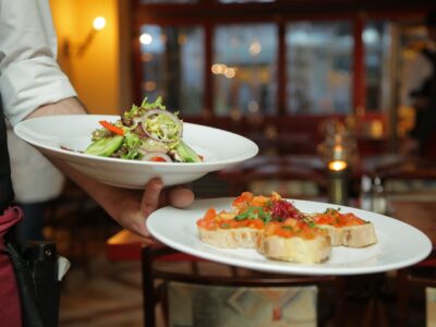 Person Holding Pastry Dishes on White Ceramic Plates