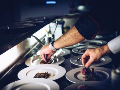 person preparing cooked dish